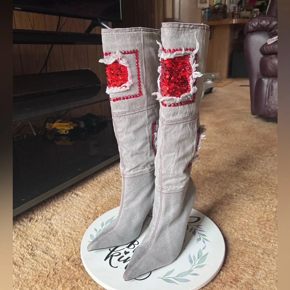 Woman’s multi-color red stone denim pointy toe knee-high boots.